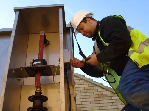 Engineer doing site maintenance work on a transformer